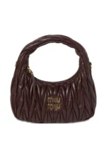 Wander matelassé leather cross body bag